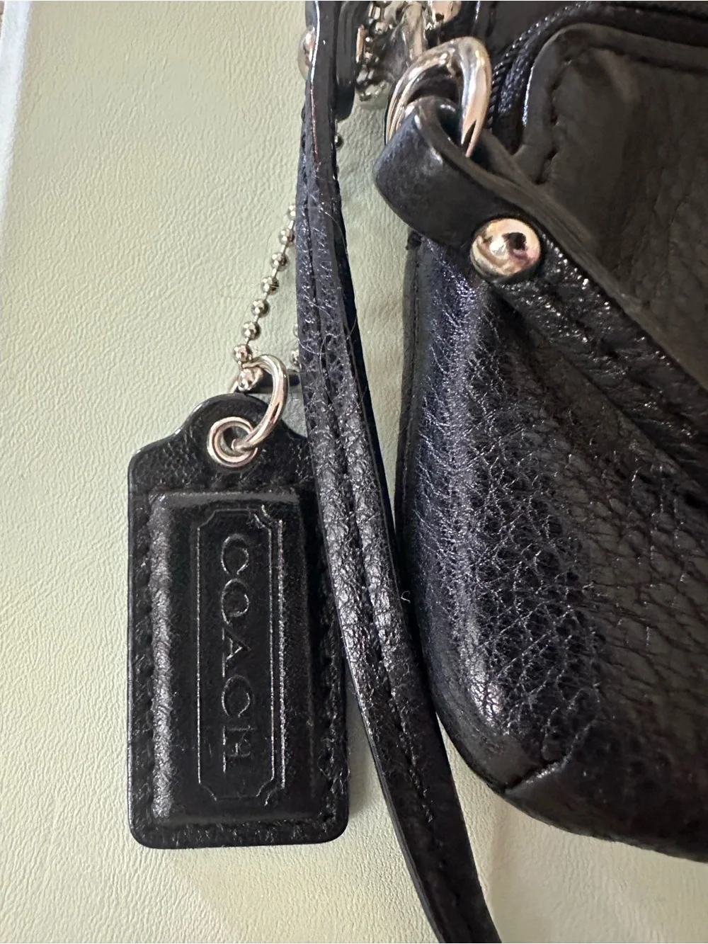 COACH Black Pebbled Leather Double Zipper Wristlet, Logo Disc, Ice Blue Lining